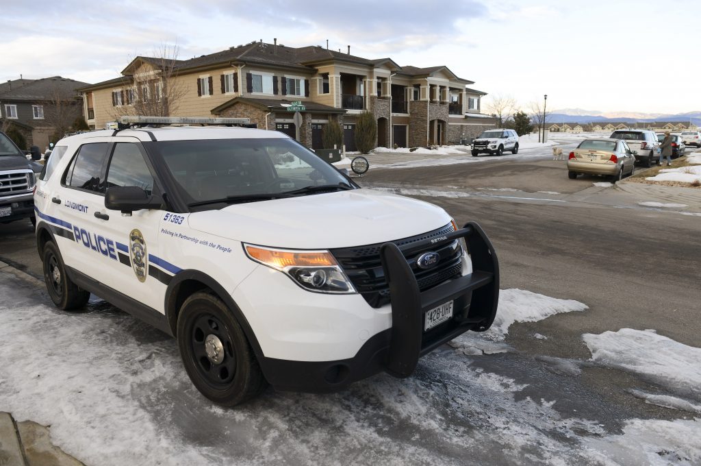 patrol car sitting in Colorado neighborhood looking out for car theft