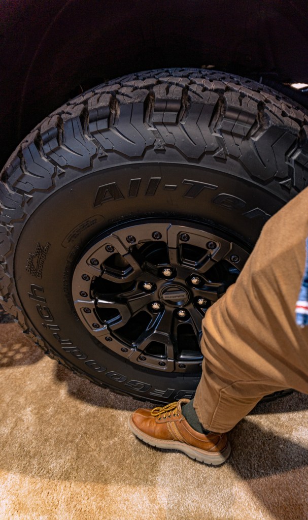 Comparing the 2022 Ford Bronco Raptor's wheel-and-tire combo to a leg