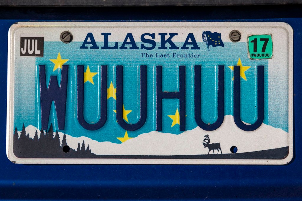 Alaskan vanity license plate on a blue car reads "WUUHUU"