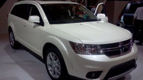 The Dodge Journey is featured on a showroom floor.
