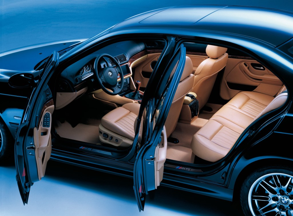 The tan-leather interior of a black E39 BMW M5
