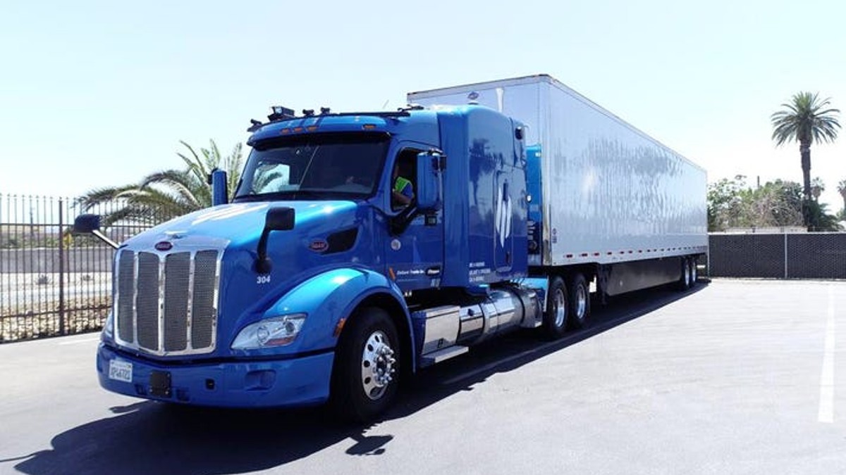 Blue Embark self-driving truck posed