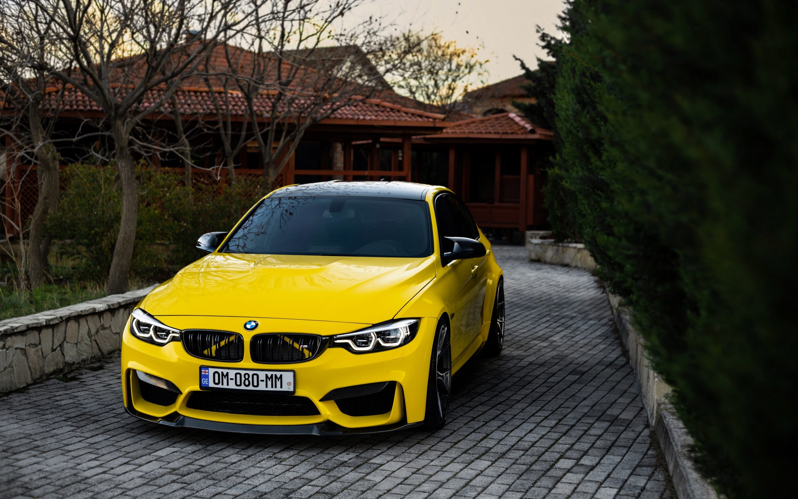 A yellow F80 shot from the front 3/4