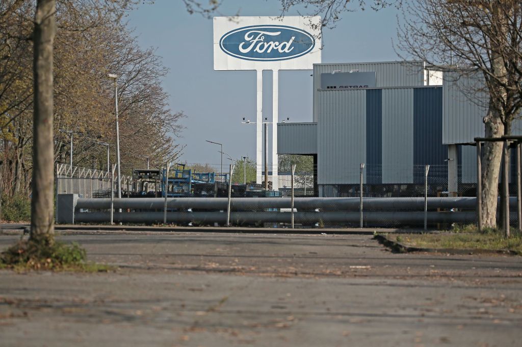 A Ford factory parking lot empty where Ford production stopped.
