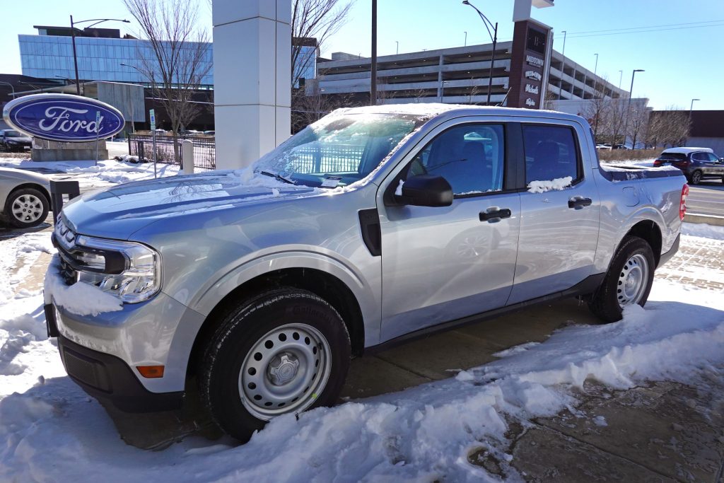 The Ford Maverick truck sits on steel wheels in snowy conditions.