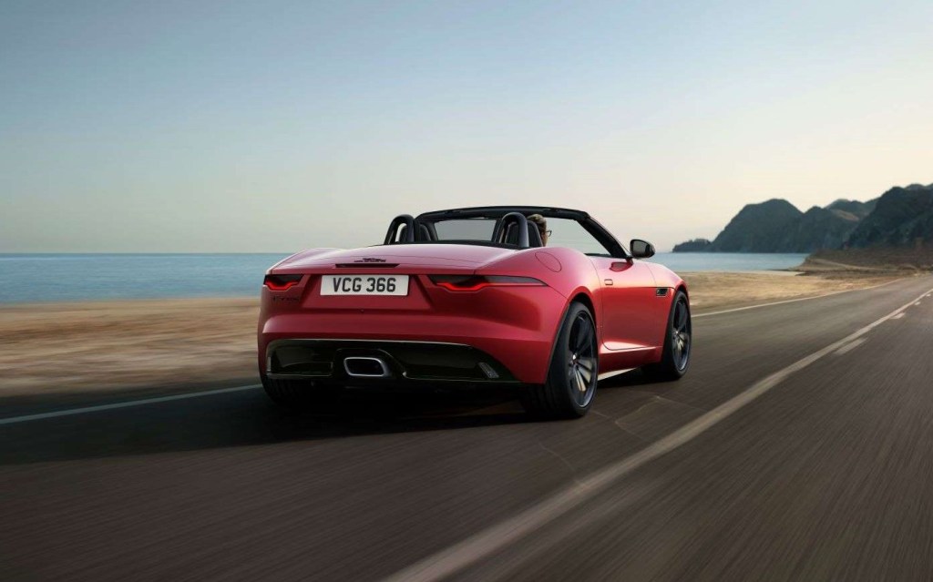 Fully loaded new red 2022 Jaguar F-TYPE R Convertible driving on a coastal road