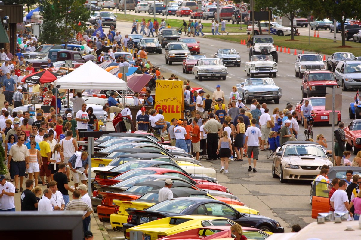 A view of Woodward Avenue crowded with people and cars during the annual Woodward Dream Cruise in Detroit, Michigan. 