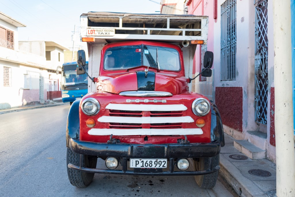 An old Dodge Ram 2500 truck taxi parked on the streets in Cuba