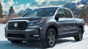 A gray 2022 Honda Ridgeline is parked in the snow.