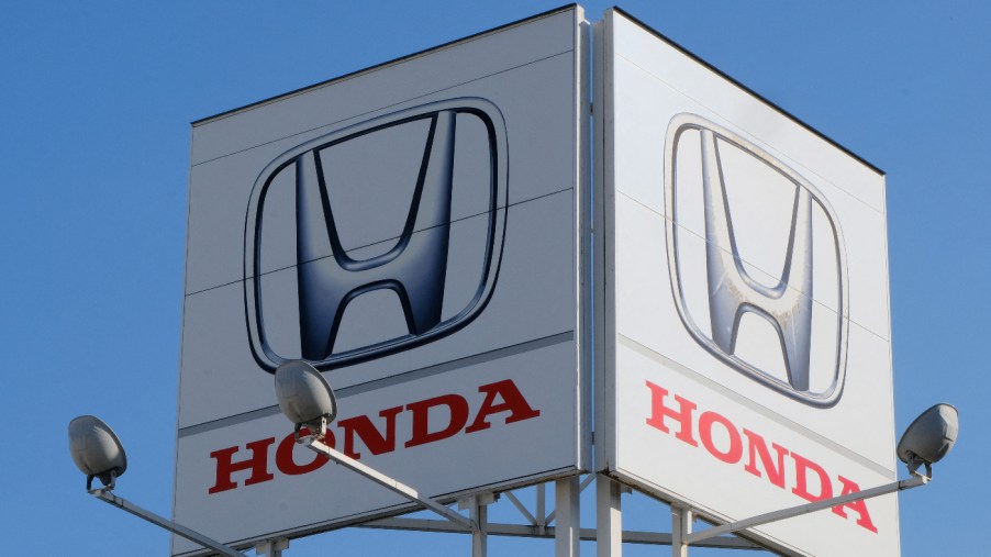 A large sign advertising the Honda brand.