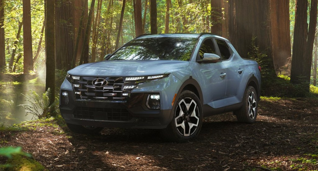 A blue Hyundai Santa Cruz is in the forest, there are some reasons not to buy the 2022 Hyundai Santa Cruz