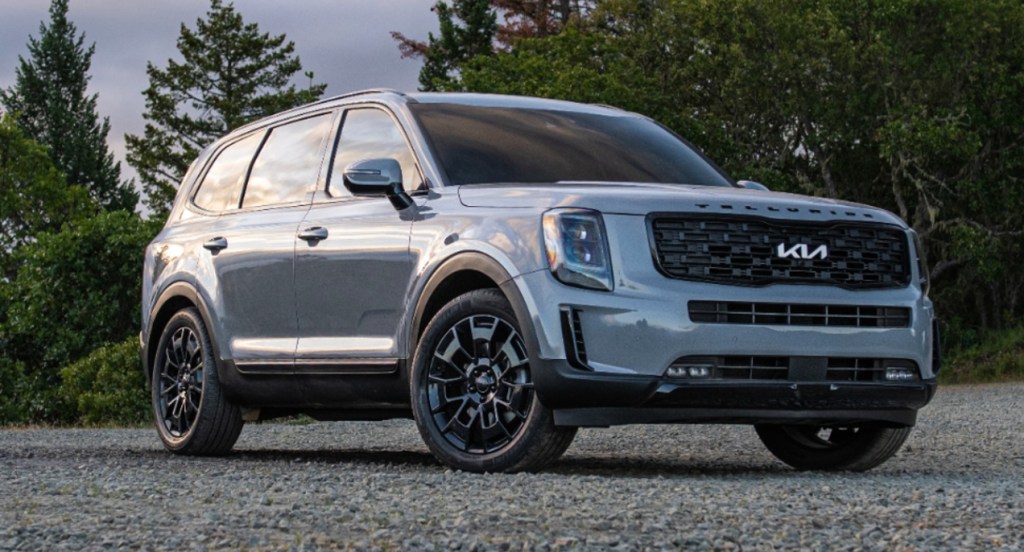 A gray Kia Telluride is parked outdoors. 