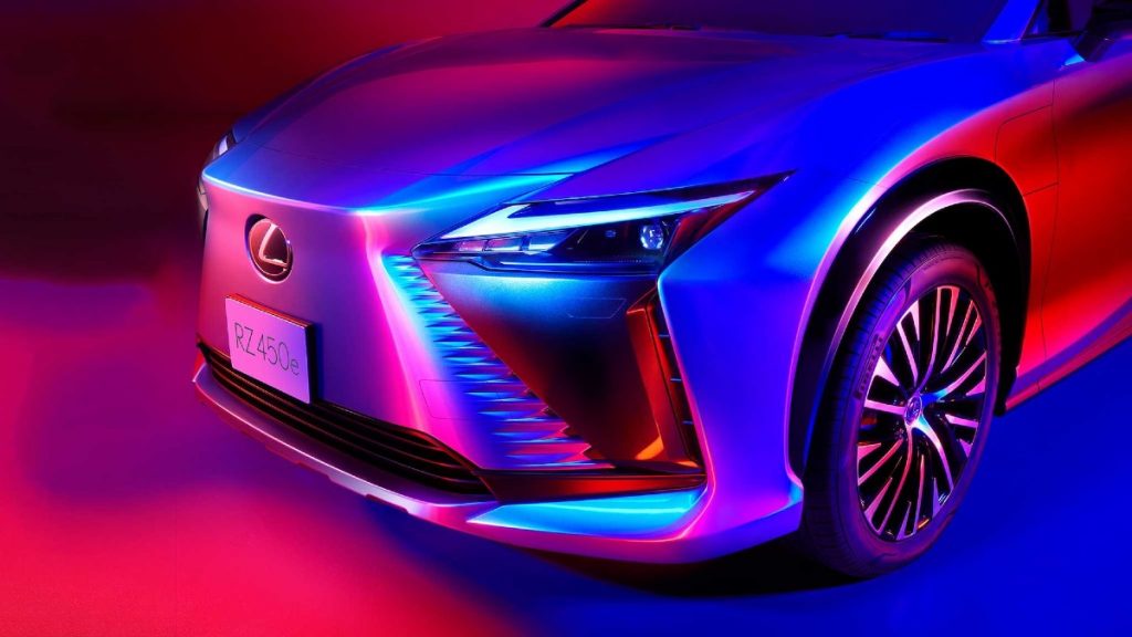 Front end of Lexus RZ450e bathed in bright colors