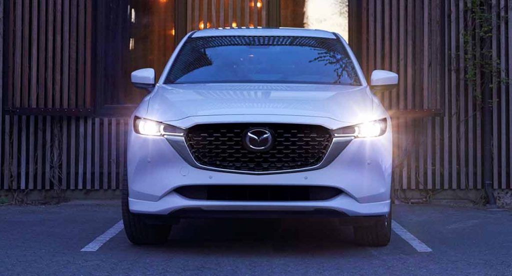 A white 2022 Mazda CX-5 small SUV is parked.
