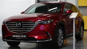 A red Mazda CX-9 midsize SUV.