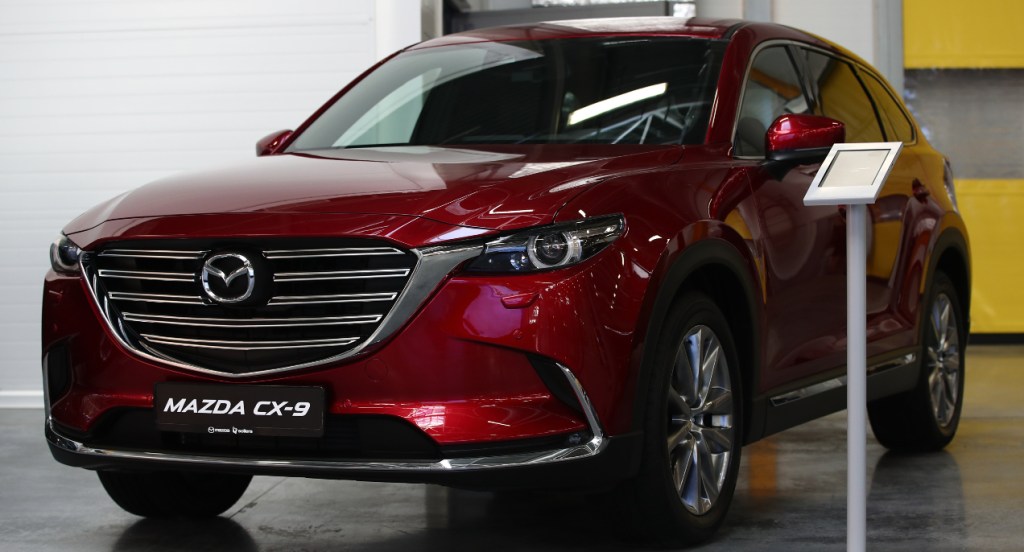 A red Mazda CX-9 midsize SUV.