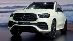 A white Mercedes-Benz GLE Class luxury compact SUV is on display.