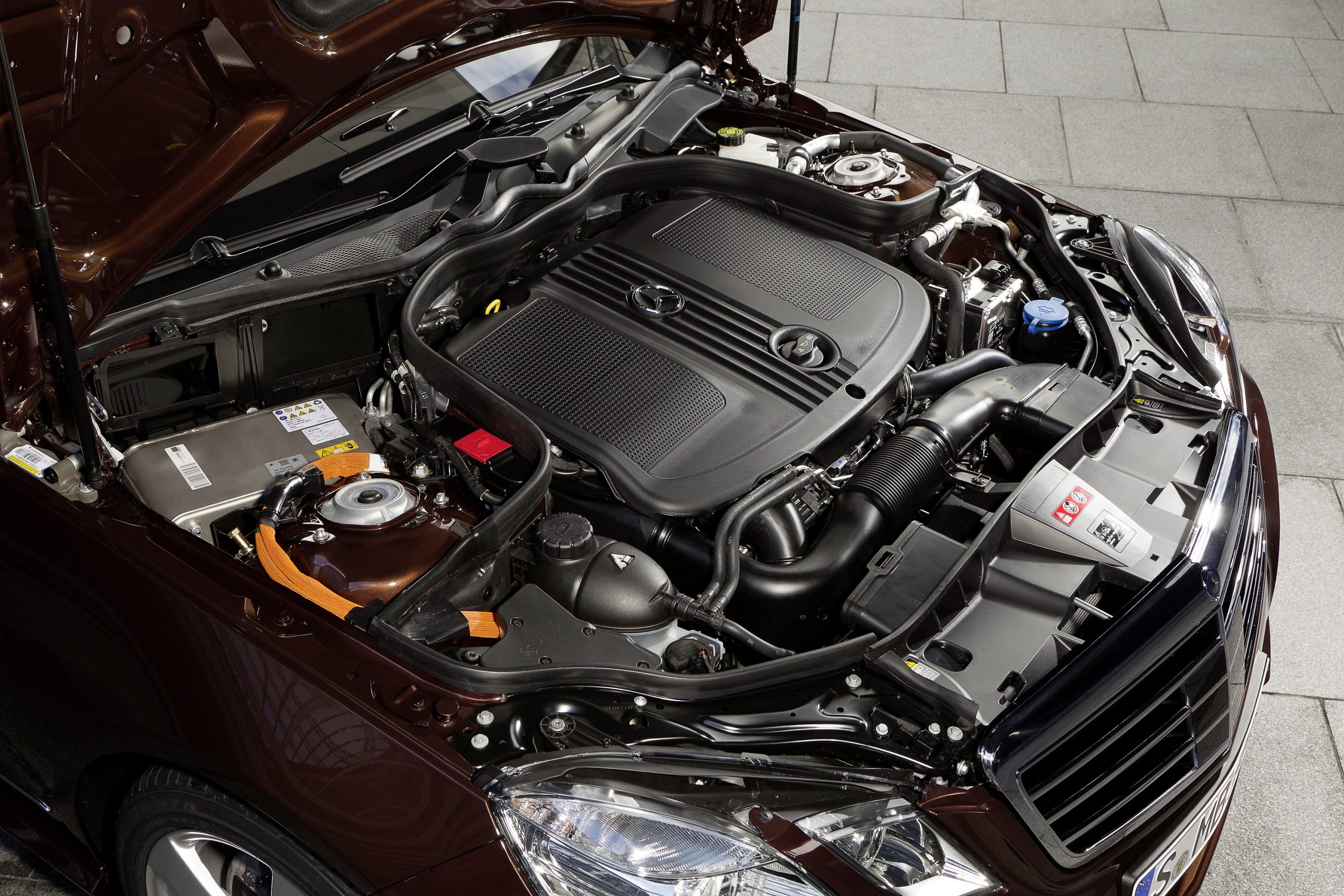 The engine bay of an E Class Mercedes-Benz hybrid