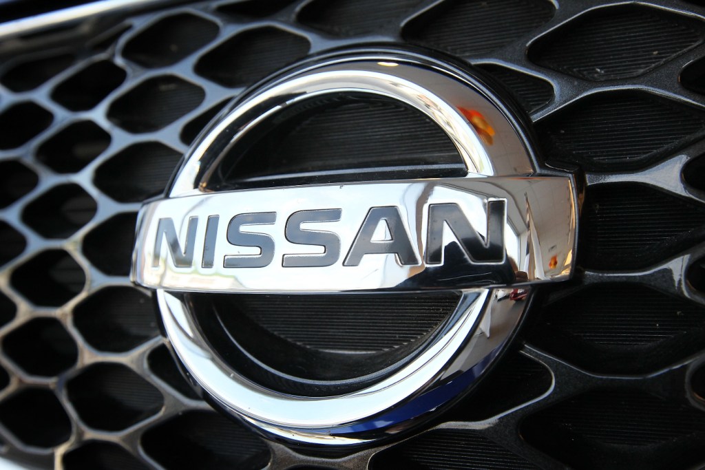 A badge off of a Nissan vehicle.