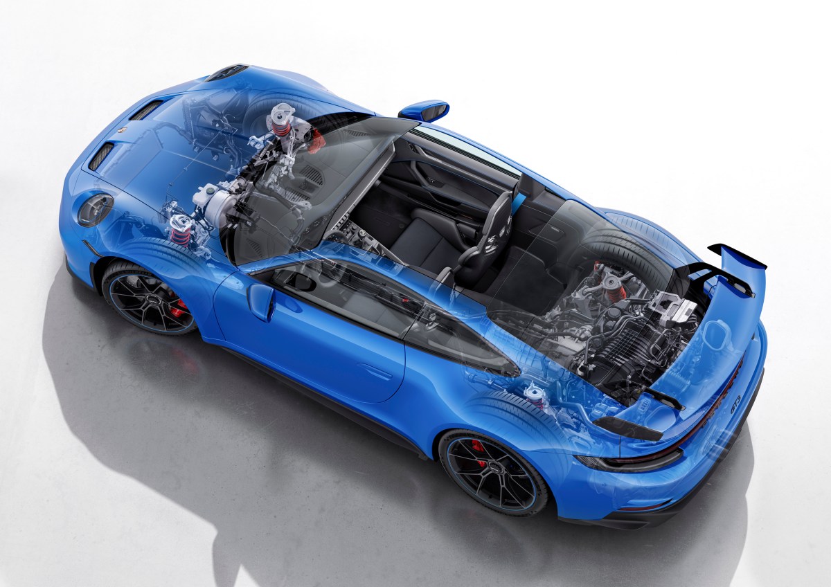 An overhead transparent view of a 2022 Porsche 911 GT3 showing the cabin, engine and front suspension.