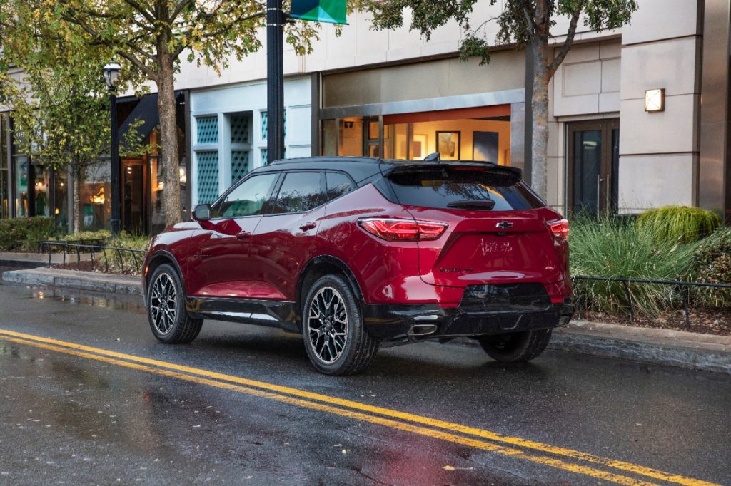 Radiant Red Metallic 2023 Chevy Blazer RS driving on a street