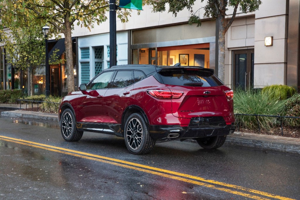 Radiant Red Metallic 2023 Chevy Blazer RS driving on a street