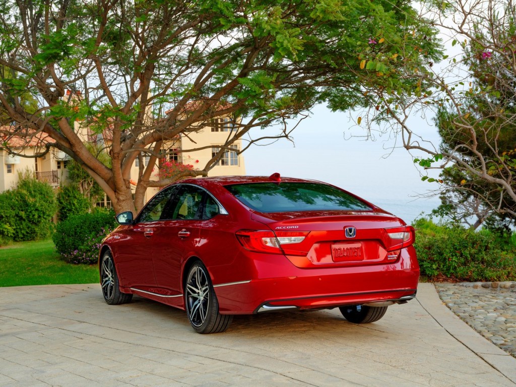 Rear view of red 2022 Honda Accord Hybrid, highlighting release date and price of 2023 Accord Hybrid