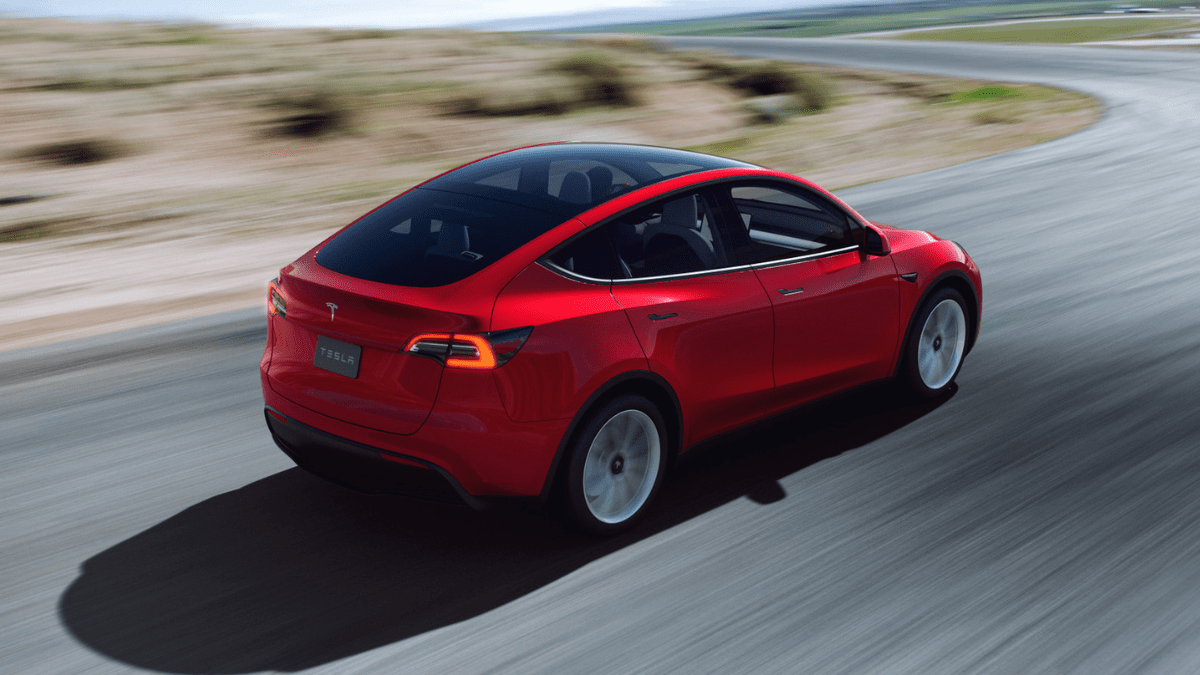 https://www.motorbiscuit.com/wp-content/uploads/2022/02/Red-Multi-Coat-2022-Tesla-Model-Y-driving-on-a-curvy-road.png?w=1200