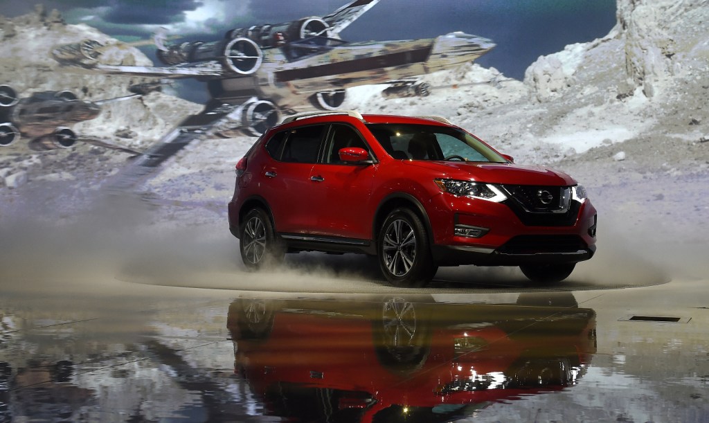 The Nissan Rogue is on display at an auto show. 