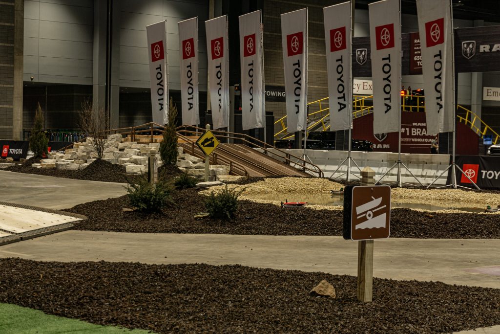 A wooden roller-equipped ramp at the 2022 Chicago Auto Show Toyota Tundra test track