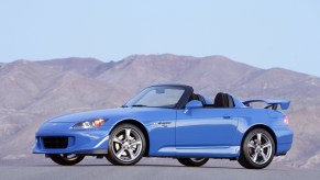 Driver Side of Blue 2009 Honda S2000 CR Convertible Club Racer with Top Down in front of a mountain range