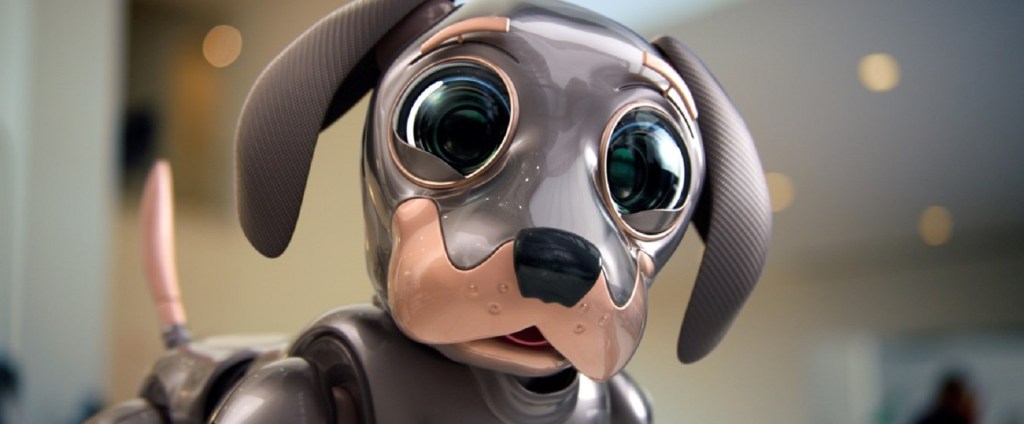 A brown robot dog with wide black eyes.