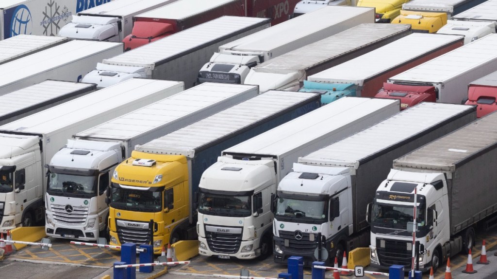 A Row of Semi Trucks Waiting to Cross the Border