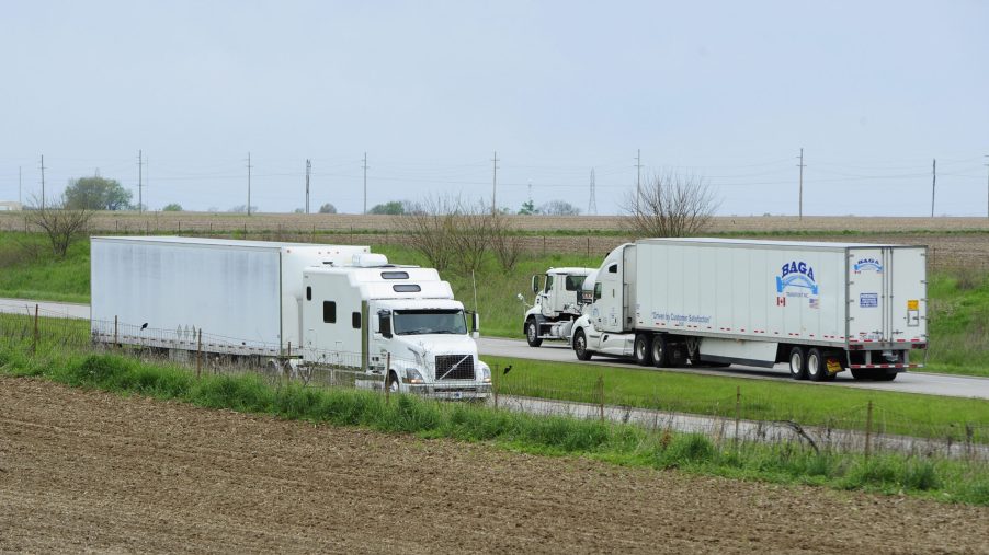 Two Semis passing each other on the highway