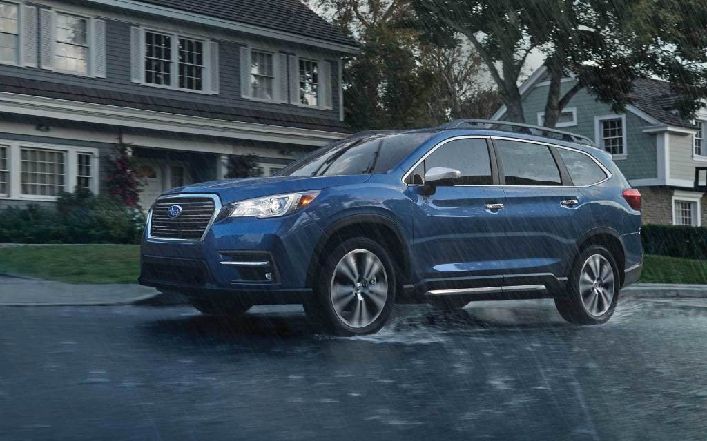 The Subaru Ascent sits tall during a rainstorm. A Subaru Ascent Wilderness would have even more ground clearance.