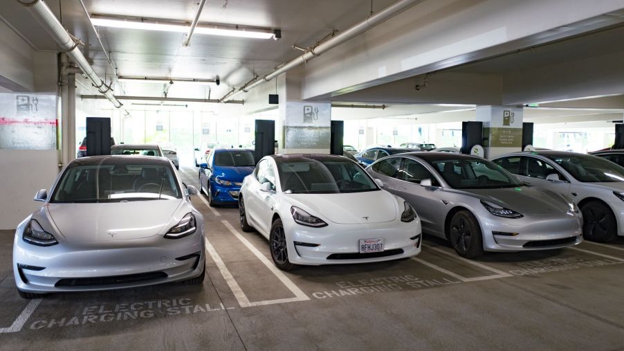 Tesla Model 3 cars charging inside a parking garage in San Ramon, California