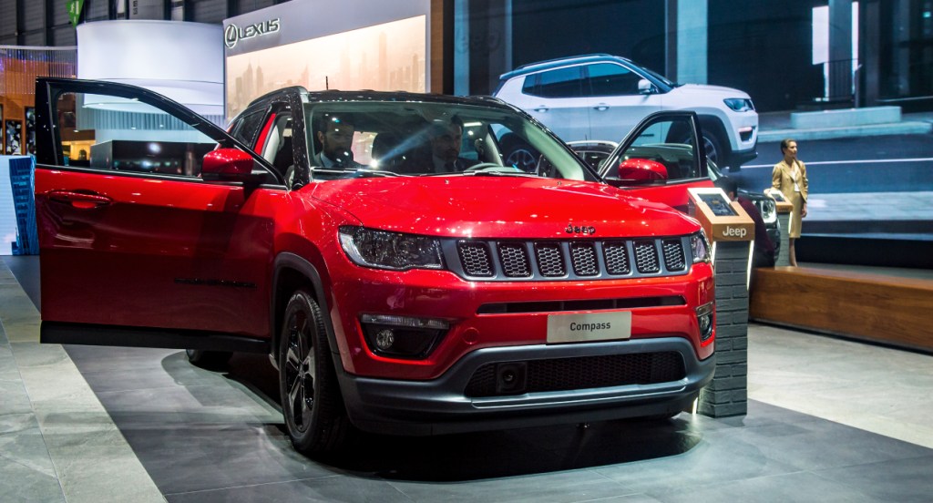 A red 2022 Jeep compass small SUV is on display.