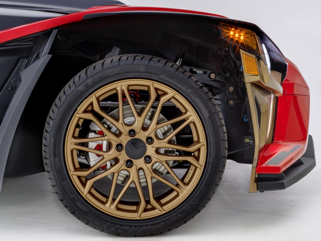 The 2022 Polaris Slingshot Signature LE's bronze front wheel