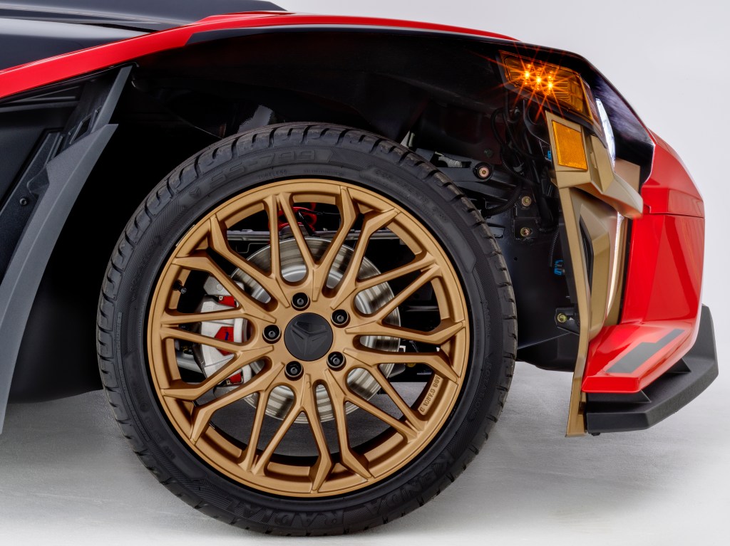 The 2022 Polaris Slingshot Signature LE's bronze front wheel