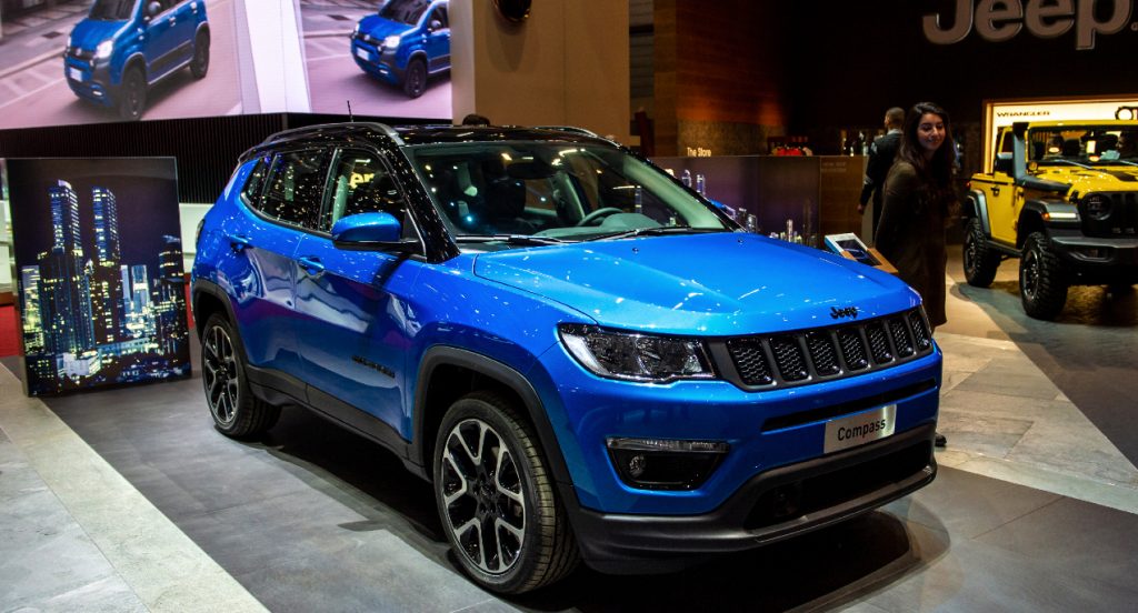 A blue Jeep Compass is on display.