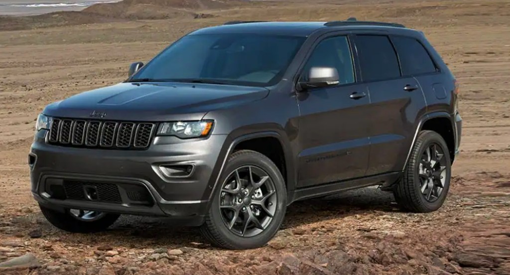 A gray Jeep Grand Cherokee is parked outdoors.