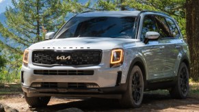 The Kia Telluride is parked outdoors.