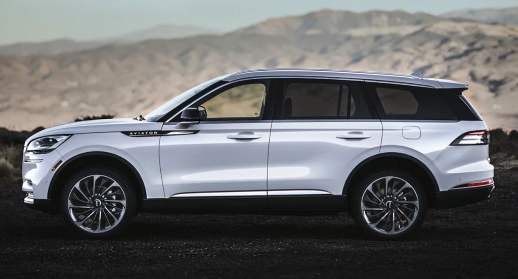 A white Lincoln Aviator large SUV is parked.