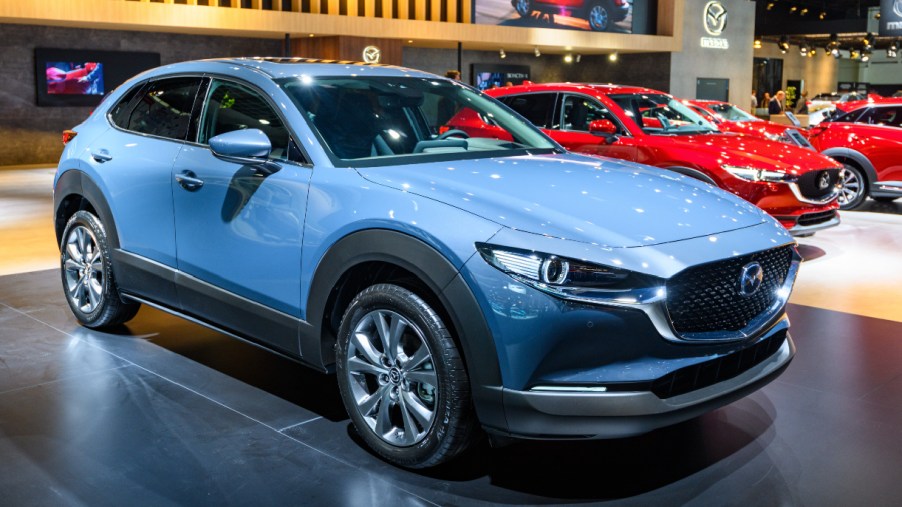 A blue Mazda CX-30 subcompact SUV is on display.