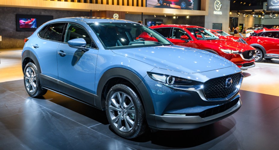 A blue Mazda CX-30 subcompact SUV is on display.