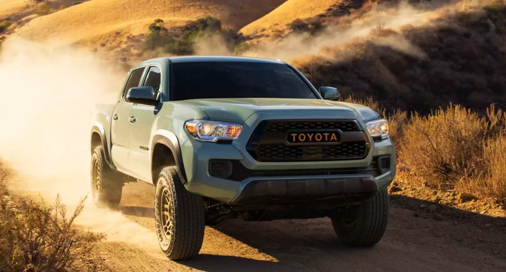 A Toyota Tacoma midsize truck shown in Lunar Rock color. 