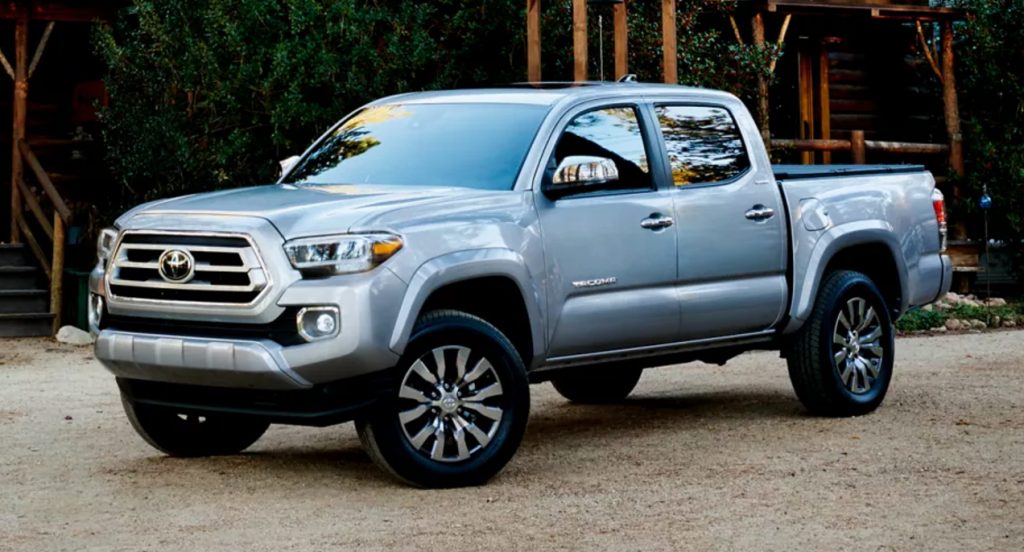 A gray Toyota Tacoma is parked. 
