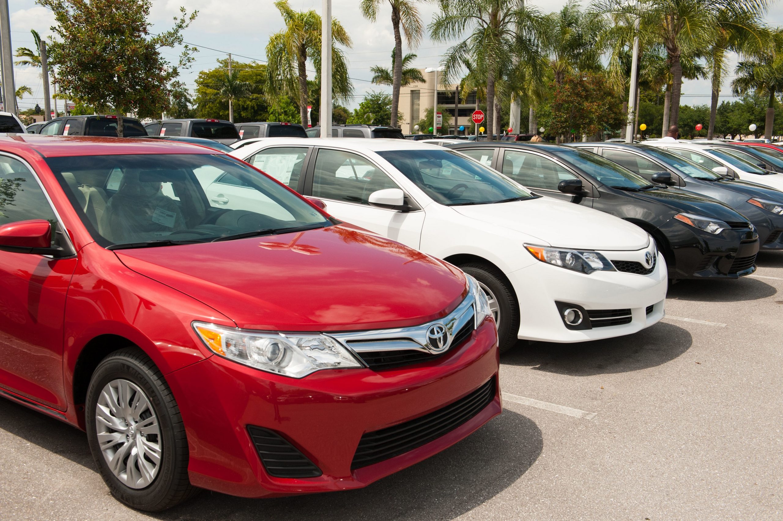 A group of Toyota Camry sedans on a dealer lot circa 2014