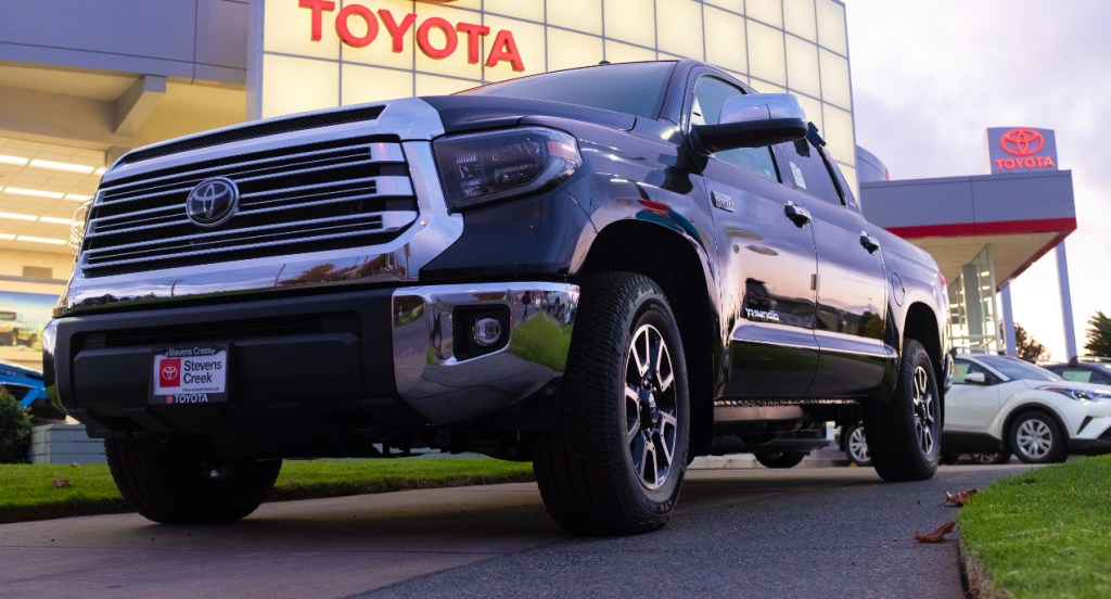 A gray Toyota Tundra is parked.