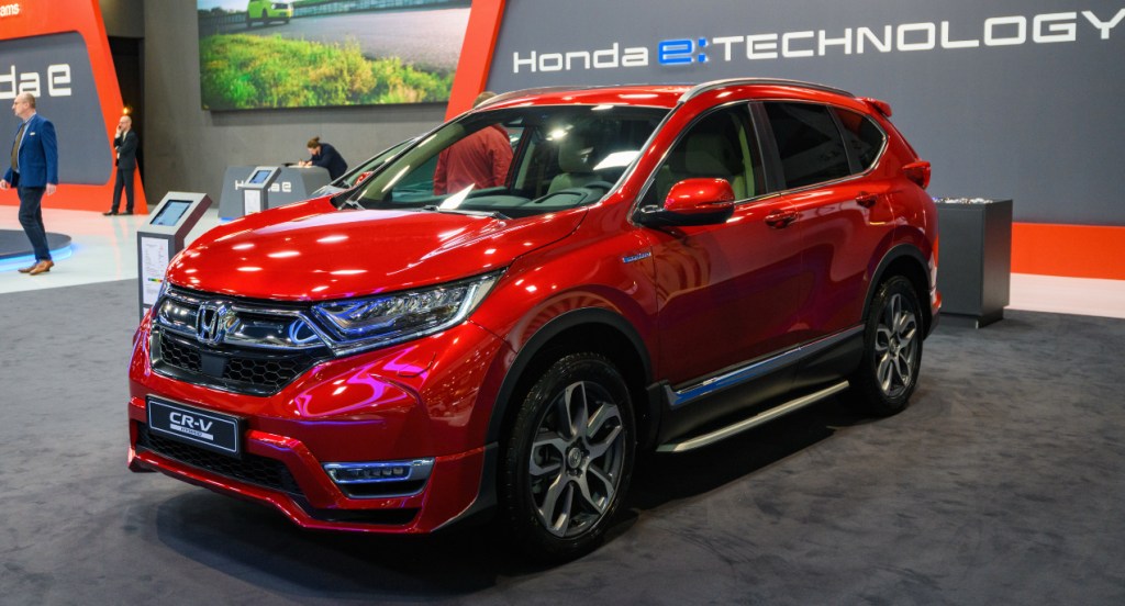 A red Honda CR-V SUV is on display. 
